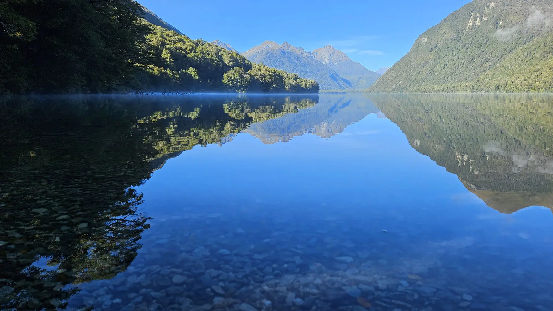 Amazing reflections of the moutains across Lake Gunn in Fiordland